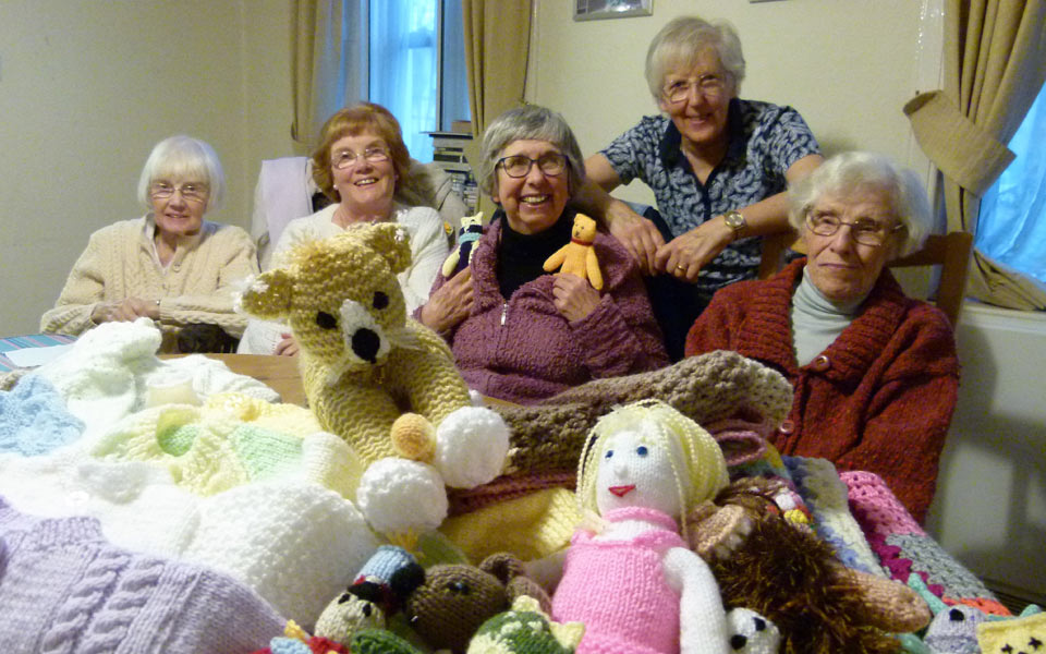 Residents at the Dulwich Almshouse knitting for premature babies